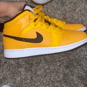 Gold/black nikes